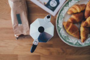 Coffee pot and croissants