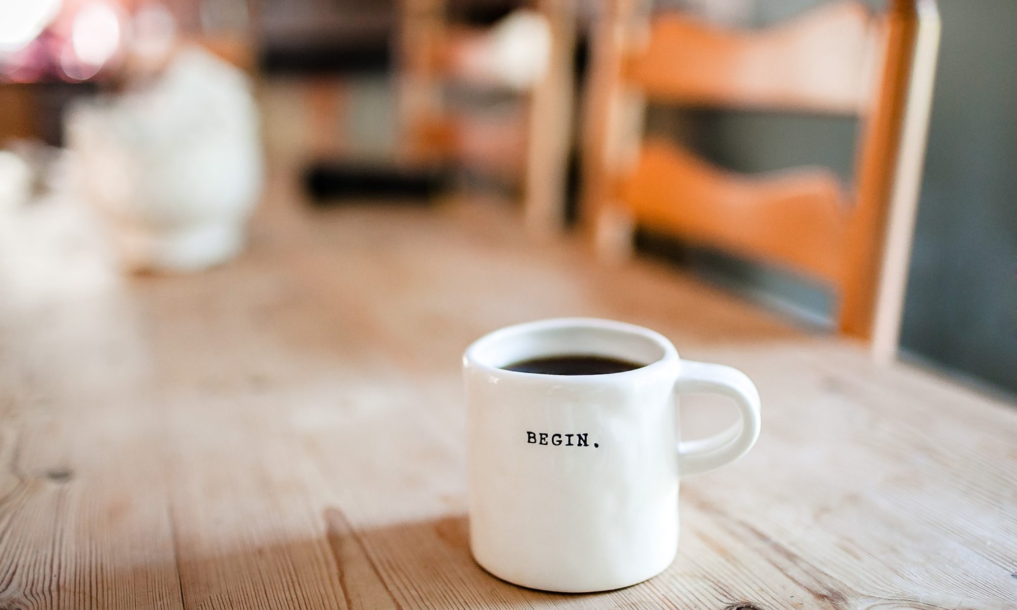 Coffee mug with word "begin"